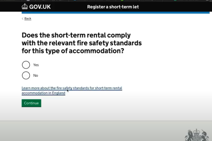 Screenshot of a page showing a heading that reads: ‘Does the short-term rental comply with the relevant fire safety standards for this type of accommodation?’. Beneath this there are two radio buttons that have a “yes” and “no” option. Beneath this there is a link that reads “ Learn more about the fire safety standards for short-term rental accommodation in England” Below this there is a green action button labelled “continue”.